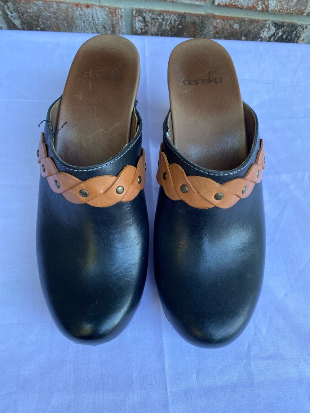 Dansko Black Leather Clogs with Tan Braided Strap